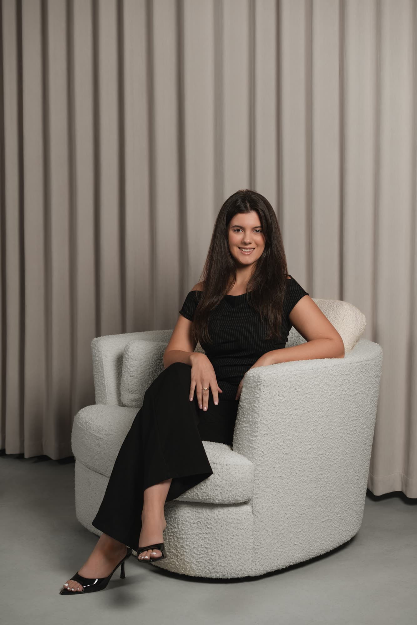 Toohey Property Management team member seated in the studio
